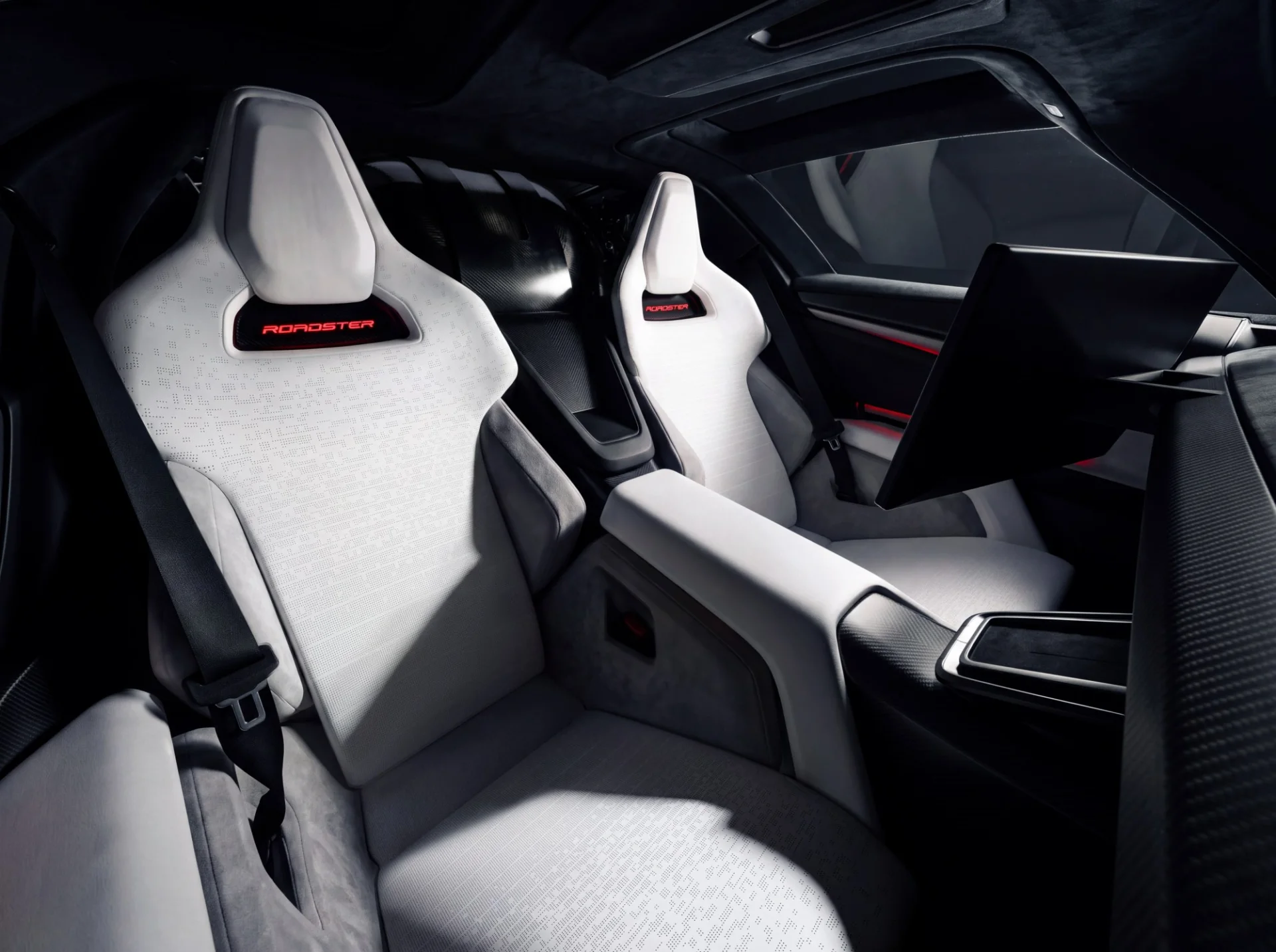 Cabine do Tesla Roadster 2026 com bancos esportivos e painel de estilo minimalista